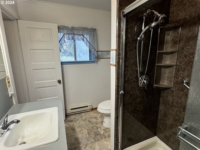 bathroom with a stall shower, toilet, a sink, and baseboard heating