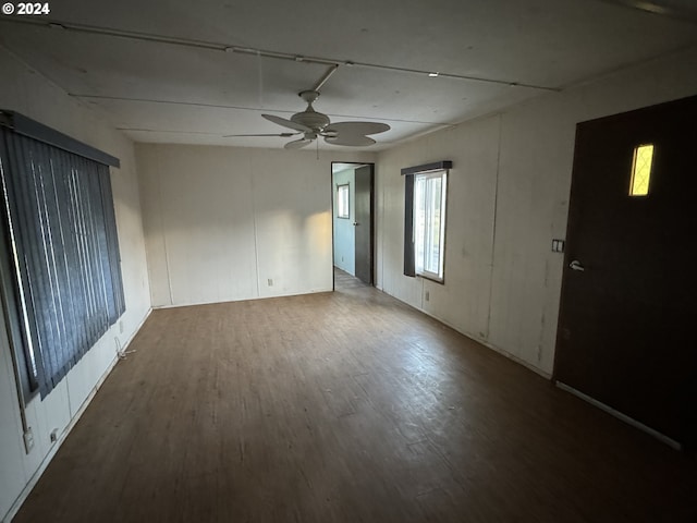 unfurnished room featuring wood finished floors and a ceiling fan