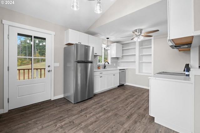 kitchen featuring sink, decorative light fixtures, white cabinets, and appliances with stainless steel finishes