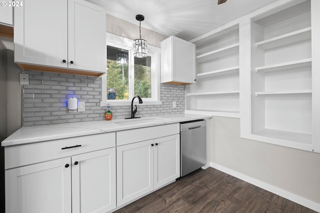 kitchen featuring decorative light fixtures, white cabinetry, dishwasher, sink, and light stone countertops