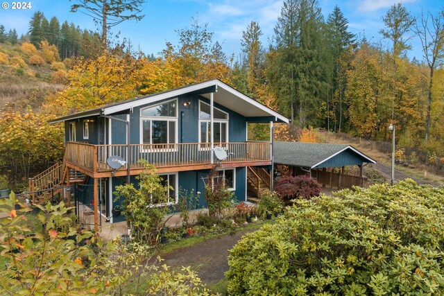 back of house with a wooden deck