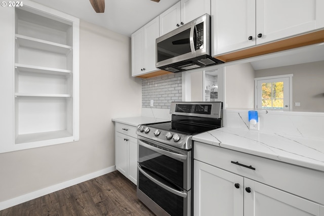 kitchen featuring white cabinetry, stainless steel appliances, dark hardwood / wood-style floors, light stone counters, and tasteful backsplash