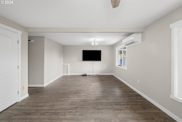 unfurnished living room featuring dark hardwood / wood-style floors and a wall mounted AC