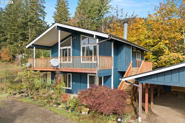 view of front of home with a carport