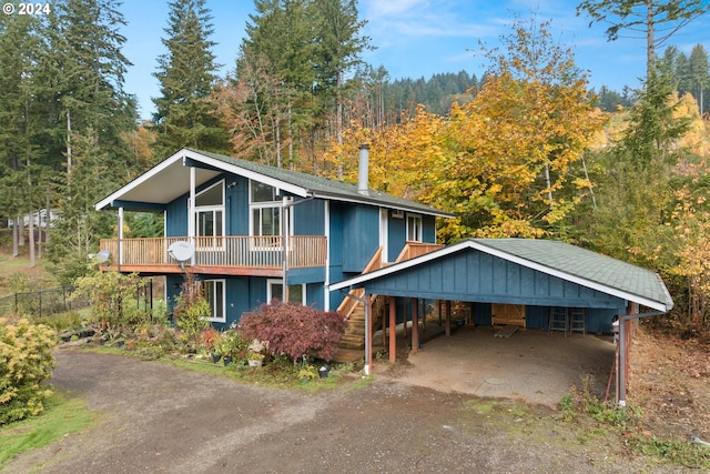 view of front facade featuring a carport and a balcony