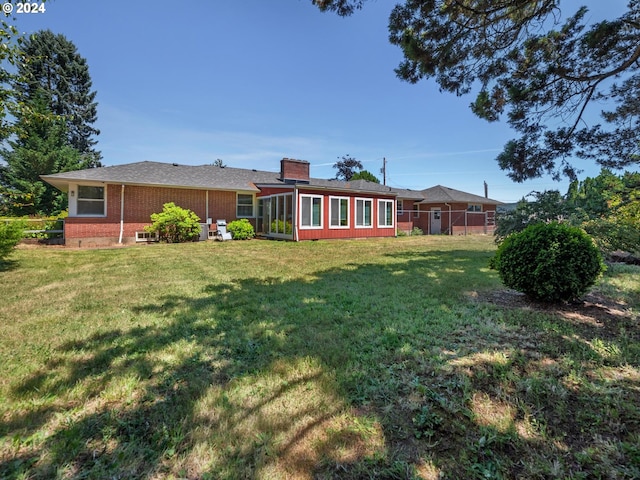 view of yard featuring a sunroom