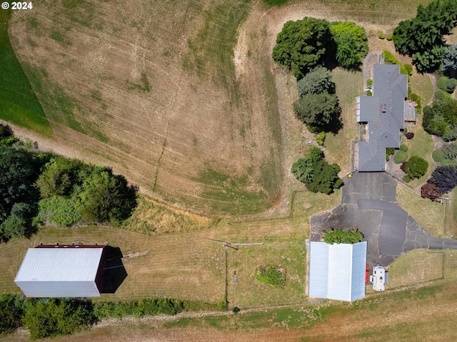 birds eye view of property with a rural view