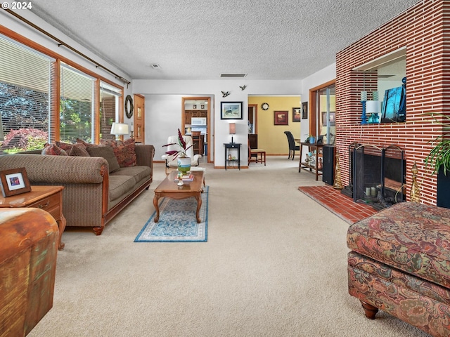 carpeted living room featuring a textured ceiling and a brick fireplace