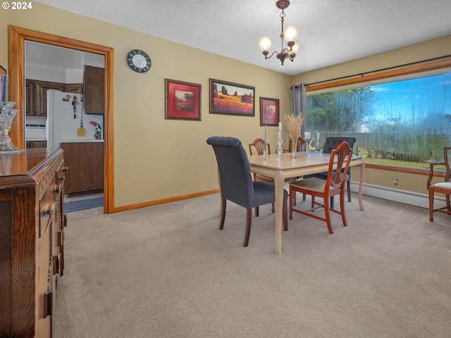 dining room with a chandelier, light carpet, a textured ceiling, and a baseboard heating unit