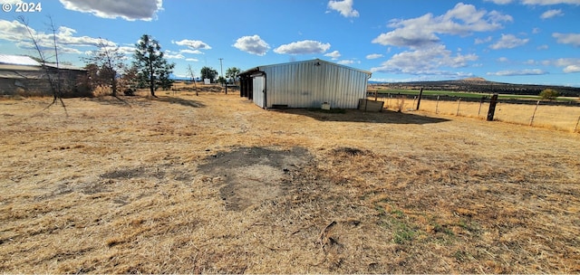 view of outbuilding with a rural view