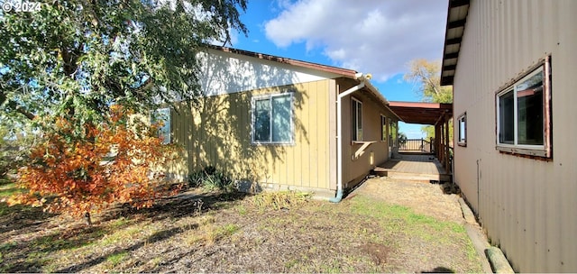 view of side of property with a wooden deck