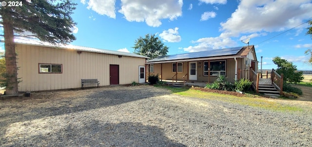 view of front of property with solar panels