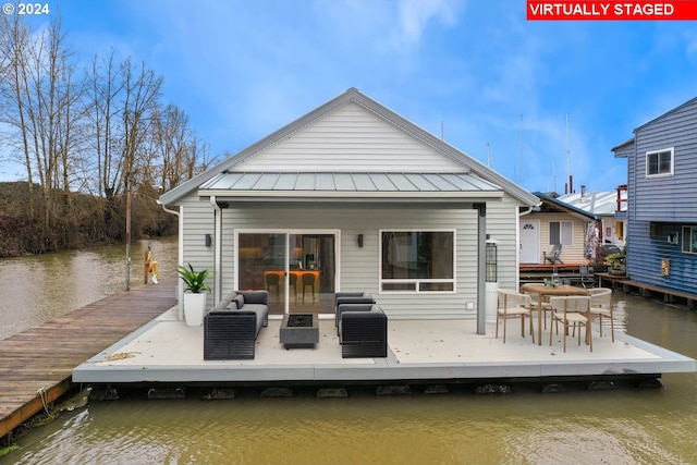 back of house with a water view