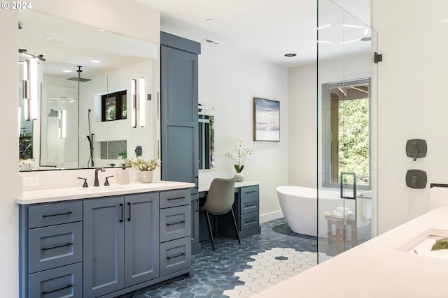 bathroom featuring tile patterned floors, plus walk in shower, and vanity