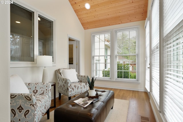 living area with light wood-type flooring, wood ceiling, and lofted ceiling