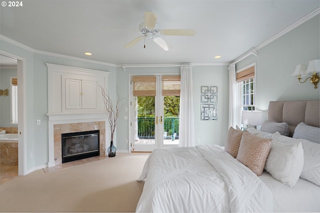 carpeted bedroom featuring access to outside, ornamental molding, multiple windows, and ceiling fan