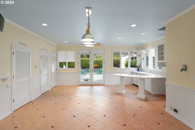 bathroom featuring french doors, ornate columns, and ornamental molding