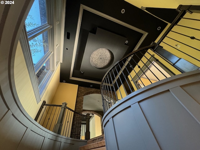 staircase featuring a high ceiling