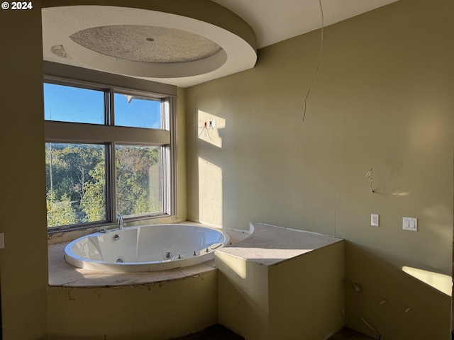 bathroom with a tub to relax in