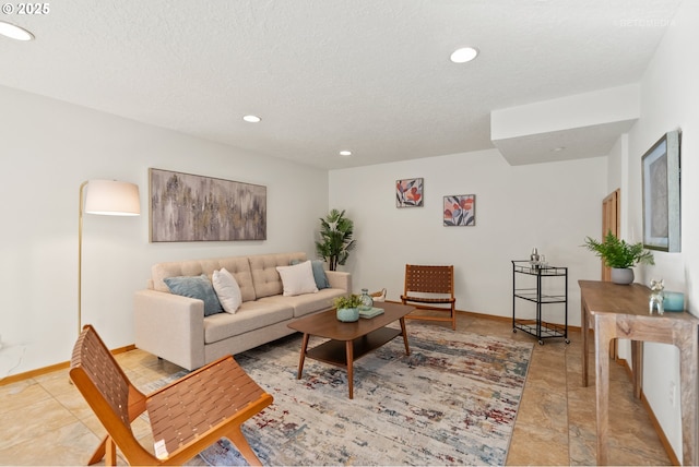 living room with a textured ceiling