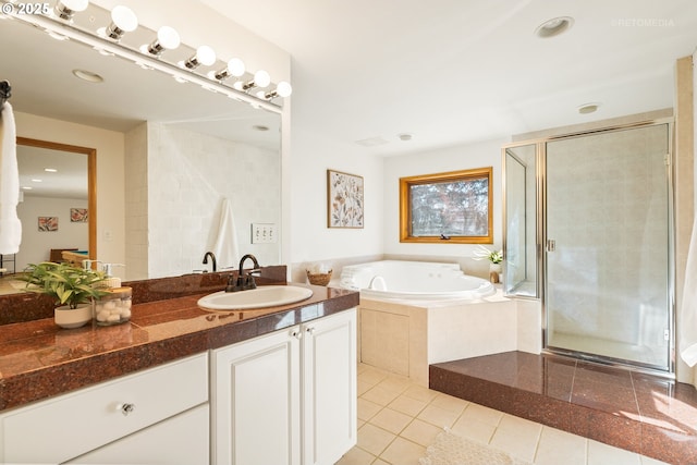 bathroom with vanity, shower with separate bathtub, and tile patterned flooring