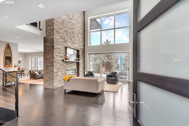 3425 NW Fairway Heights Dr, Bend, OR 97703 - living room featuring a high ceiling, wood finished floors, a fireplace, and recessed lighting