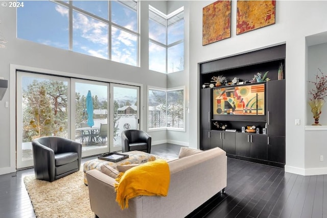 3425 NW Fairway Heights Dr, Bend, OR 97703 - living room with baseboards, dark wood-type flooring, healthy amount of natural light, and a towering ceiling
