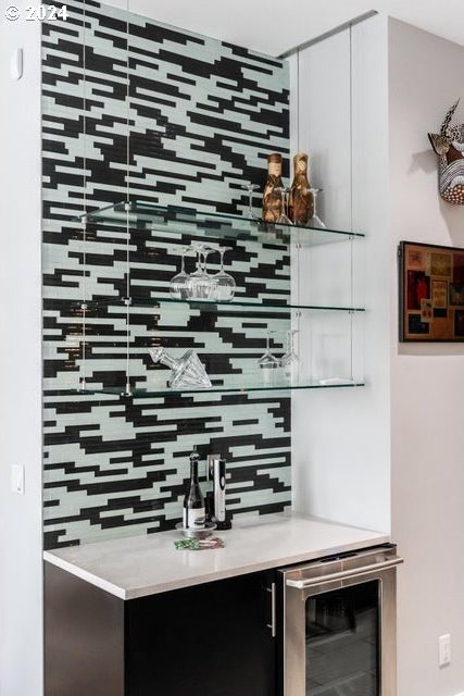 3425 NW Fairway Heights Dr, Bend, OR 97703 - indoor bar featuring wine cooler and tasteful backsplash