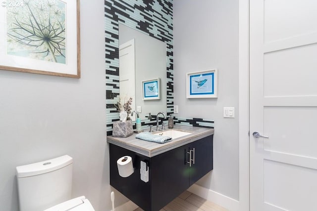 3425 NW Fairway Heights Dr, Bend, OR 97703 - bathroom with toilet, vanity, and baseboards
