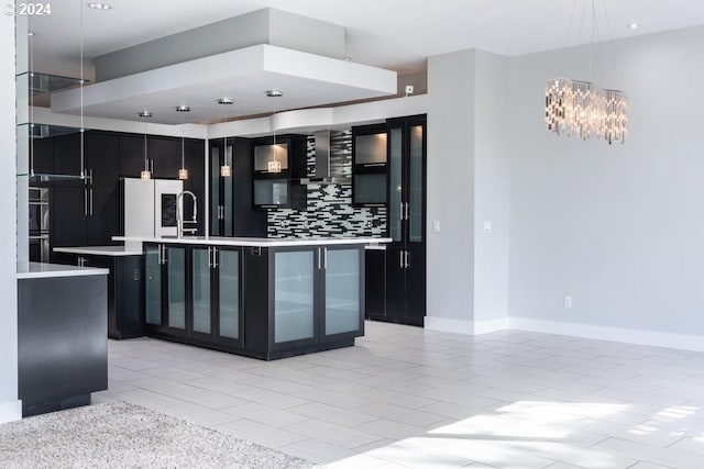 3425 NW Fairway Heights Dr, Bend, OR 97703 - kitchen with dark cabinetry, freestanding refrigerator, light countertops, decorative backsplash, and recessed lighting
