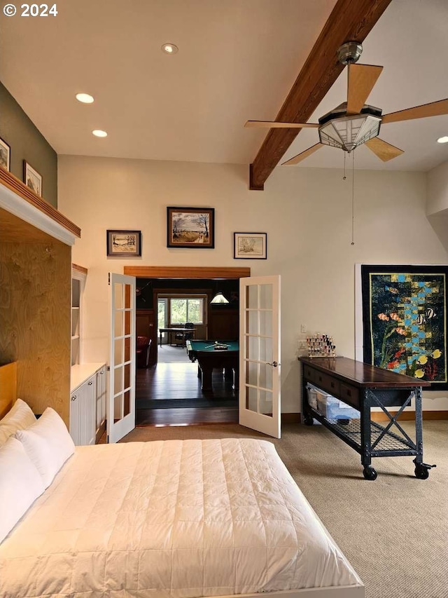 unfurnished bedroom featuring beamed ceiling, billiards, hardwood / wood-style floors, french doors, and ceiling fan