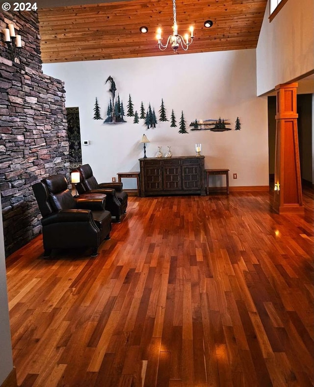 interior space featuring wood ceiling, an inviting chandelier, a towering ceiling, and dark hardwood / wood-style flooring