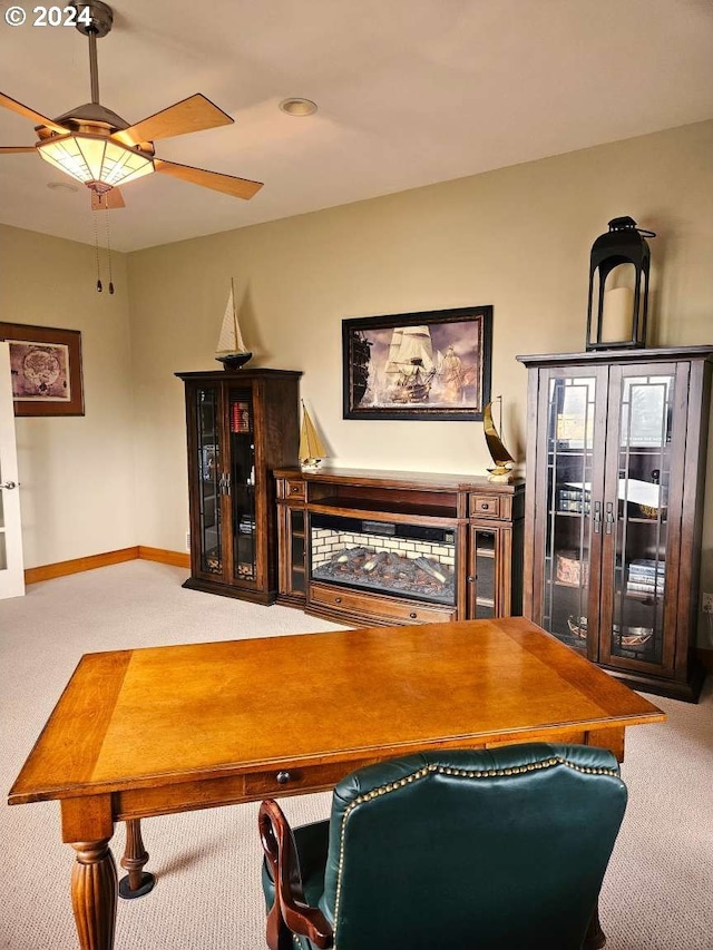 carpeted dining area featuring ceiling fan