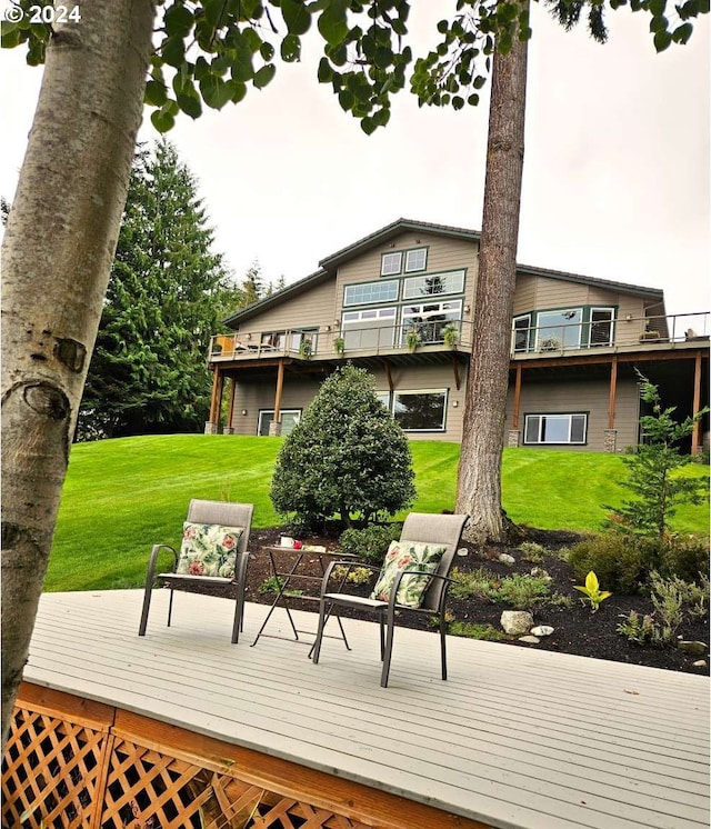 wooden deck with a lawn