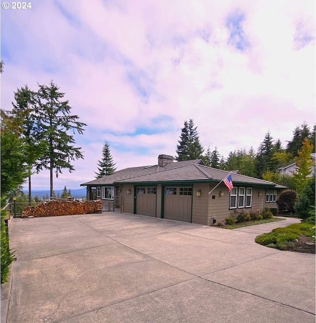 single story home featuring a garage