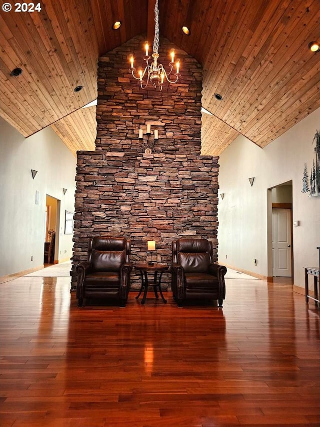 unfurnished room featuring high vaulted ceiling, a notable chandelier, wood-type flooring, and wooden ceiling