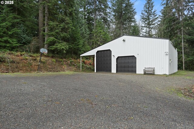 garage with a workshop area and electric panel