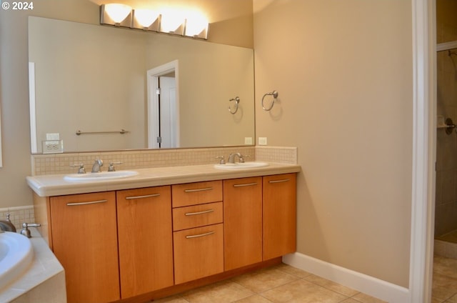 bathroom with tile patterned flooring, vanity, and walk in shower