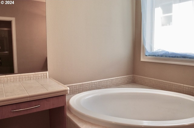 clothes washing area featuring cabinets, electric dryer hookup, sink, and hookup for a washing machine