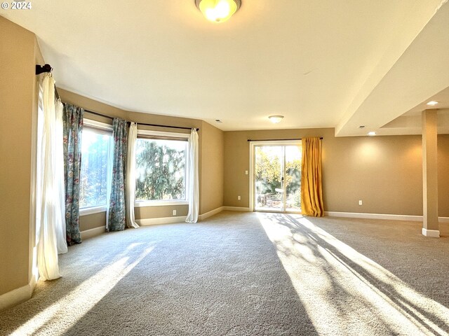 spare room with light colored carpet