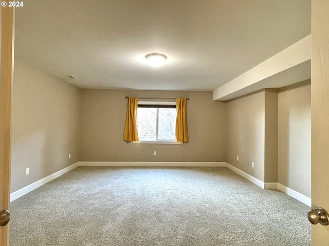 spare room with carpet flooring