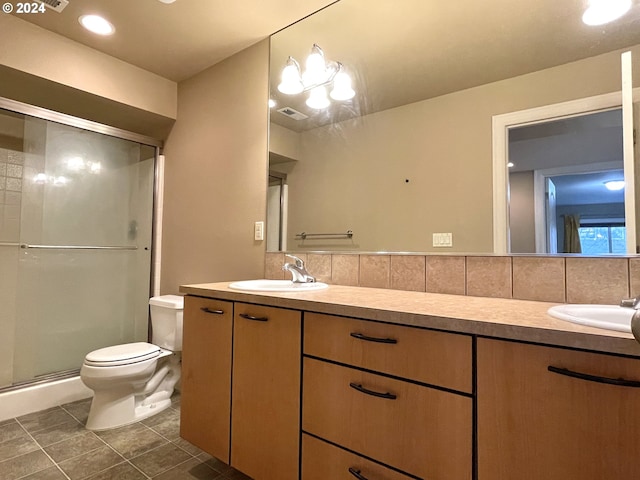 bathroom with vanity, backsplash, toilet, and walk in shower