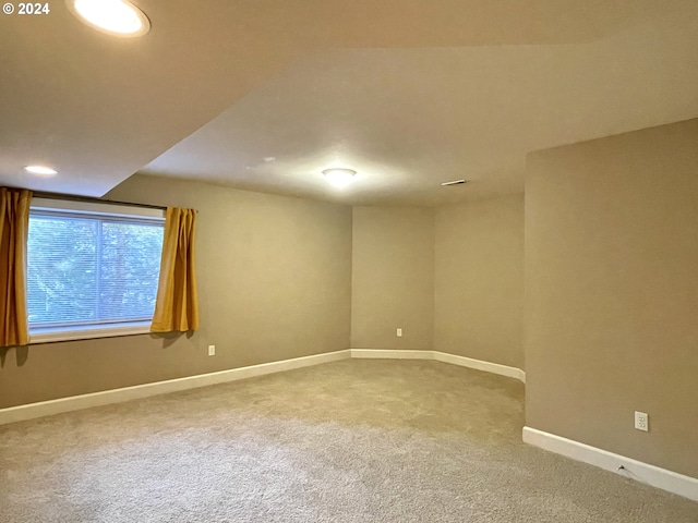 unfurnished room featuring carpet