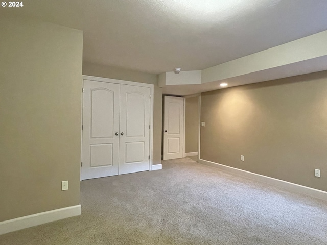 unfurnished bedroom featuring carpet floors and a closet