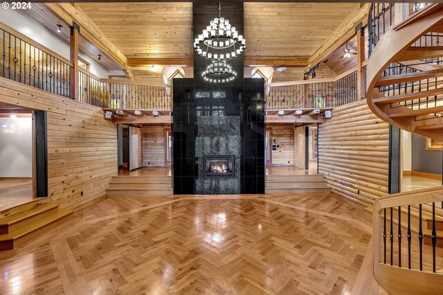 unfurnished living room featuring a fireplace, parquet floors, and wood ceiling