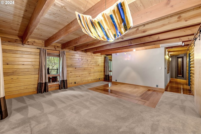 unfurnished living room featuring wood-type flooring, wood ceiling, wood walls, and beam ceiling