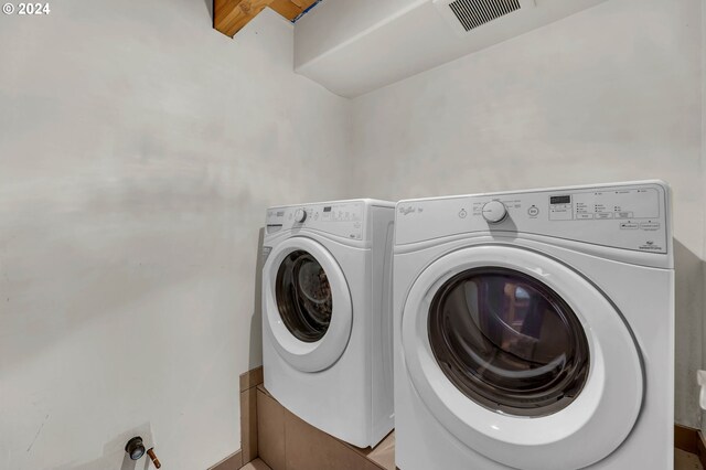 laundry area with separate washer and dryer