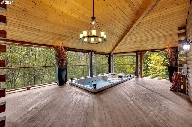 exterior space with an outdoor hot tub