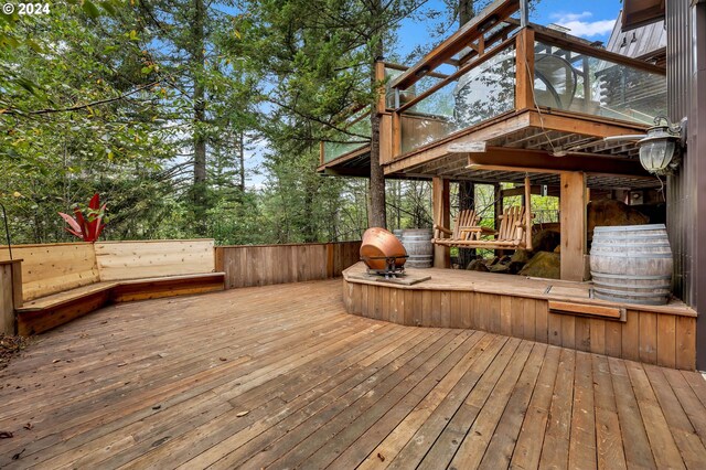 wooden deck with a sunroom