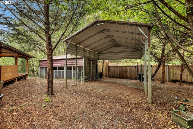 view of outbuilding with a carport